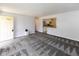 Open-concept living room showcasing neutral colors, and access to kitchen at 220 E Tilden Dr, Brownsburg, IN 46112