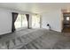 Bright living room with gray carpeting and fresh neutral paint at 220 E Tilden Dr, Brownsburg, IN 46112