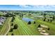 Aerial view of a lush golf course community with ponds, green fairways, and beautiful homes at 2251 Somerset Dr, Franklin, IN 46131
