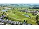 Overhead view of a golf course community featuring homes, ponds, and landscaped greens at 2251 Somerset Dr, Franklin, IN 46131