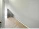 Long view of finished attic hallway with neutral color paint and carpet at 2251 Somerset Dr, Franklin, IN 46131