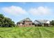 Expansive backyard with lush lawn and brick exterior, perfect for outdoor activities and relaxation at 2251 Somerset Dr, Franklin, IN 46131