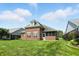 Charming brick home with a well-manicured lawn and mature landscaping in a serene backyard setting at 2251 Somerset Dr, Franklin, IN 46131