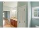 The bathroom features a double vanity and access to the primary bedroom providing a spa-like experience at 2251 Somerset Dr, Franklin, IN 46131