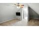 Upstairs bedroom with modern ceiling fan and mounted television at 2251 Somerset Dr, Franklin, IN 46131