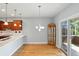 Light and airy dining area featuring hardwood floors and modern chandelier at 2251 Somerset Dr, Franklin, IN 46131
