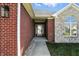 Inviting entrance featuring a brick and stone facade, a walkway, and a well-maintained front lawn at 2251 Somerset Dr, Franklin, IN 46131