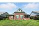 Well-maintained brick home featuring a spacious backyard and a view of the surrounding neighborhood at 2251 Somerset Dr, Franklin, IN 46131