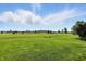 Scenic view of a well-manicured golf course surrounded by beautiful homes on a bright, sunny day at 2251 Somerset Dr, Franklin, IN 46131