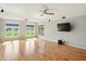 Open living room with hardwood floors, large windows, and a ceiling fan at 2251 Somerset Dr, Franklin, IN 46131