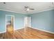 Sun-lit main bedroom has hardwood floors, is attached to the main bath, and is connected to a hallway at 2251 Somerset Dr, Franklin, IN 46131