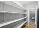 Spacious pantry features adjustable shelving and is conveniently located near the bathroom for easy storage at 2251 Somerset Dr, Franklin, IN 46131