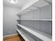 Bright pantry boasts adjustable shelving for customizable storage solutions, optimizing space for organization at 2251 Somerset Dr, Franklin, IN 46131