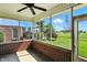 Inviting screened-in porch with brick accents and a view of the serene green outdoor space at 2251 Somerset Dr, Franklin, IN 46131