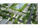 An aerial view of a suburban neighborhood with tree-lined streets and homes with well-kept lawns near a pond at 2253 Bridlewood Dr, Franklin, IN 46131