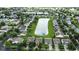 Expansive aerial view of a suburban community, complete with a pond, lush landscaping, and single-Gathering homes at 2253 Bridlewood Dr, Franklin, IN 46131