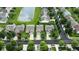 An aerial view shows a neighborhood with manicured lawns, mature trees, and access to a serene pond at 2253 Bridlewood Dr, Franklin, IN 46131