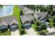 Aerial view of a community of homes surrounding a pond with a fountain at 2253 Bridlewood Dr, Franklin, IN 46131