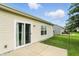 Backyard view of sliding glass door and green grass at 2253 Bridlewood Dr, Franklin, IN 46131