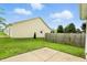 A concrete patio in a well maintained backyard with a wooden fence at 2253 Bridlewood Dr, Franklin, IN 46131
