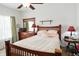 Bedroom with warm color palette, ceiling fan, natural light, wood bed frame and matching bedroom furniture set at 2253 Bridlewood Dr, Franklin, IN 46131
