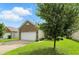 Lovely home featuring a two-car garage, nice lawn, and mature trees at 2253 Bridlewood Dr, Franklin, IN 46131