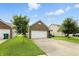 A well-kept home with a two-car garage, a small front porch, and a green lawn at 2253 Bridlewood Dr, Franklin, IN 46131