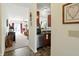 Hallway view leading into a bright living room and glimpses of the kitchen area showcasing an open floor plan at 2253 Bridlewood Dr, Franklin, IN 46131