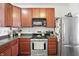 Well-equipped kitchen featuring stainless steel appliances, dark countertops, and ample cabinet space for storage and functionality at 2253 Bridlewood Dr, Franklin, IN 46131