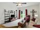 Inviting living room featuring a ceiling fan, a comfortable sofa, and a sliding glass door at 2253 Bridlewood Dr, Franklin, IN 46131