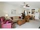 Cozy living room featuring a sofa, a ceiling fan, and an adjacent dining area at 2253 Bridlewood Dr, Franklin, IN 46131