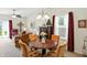 Inviting dining space featuring a round wood table with seating, complemented by ample natural light and stylish accents at 2253 Bridlewood Dr, Franklin, IN 46131