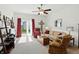 Bright living room with a ceiling fan, comfortable seating, and a sliding glass door at 2253 Bridlewood Dr, Franklin, IN 46131