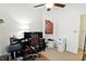 Office space with a black desk, rolling chair, dark cabinet and a ceiling fan at 2253 Bridlewood Dr, Franklin, IN 46131