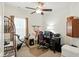 Home office area featuring a ceiling fan, desk, chair, shelves and an exercise bike at 2253 Bridlewood Dr, Franklin, IN 46131