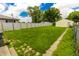 Spacious backyard with green grass and a pathway at 2350 E Legrande Ave, Indianapolis, IN 46203