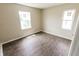 A bedroom with new wood laminate flooring and bright natural light at 2350 E Legrande Ave, Indianapolis, IN 46203