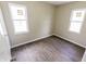 A bedroom featuring new wood laminate flooring and natural lighting at 2350 E Legrande Ave, Indianapolis, IN 46203