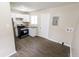 Bright kitchen featuring stainless steel appliances and new wood laminate floors at 2350 E Legrande Ave, Indianapolis, IN 46203