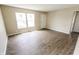 Inviting living room with updated flooring, neutral walls, and lots of natural light at 2350 E Legrande Ave, Indianapolis, IN 46203