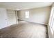 Spacious living room with light-toned walls, modern flooring and a large window at 2350 E Legrande Ave, Indianapolis, IN 46203