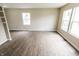 Bright living room featuring wood-look floors and freshly painted neutral walls at 2350 E Legrande Ave, Indianapolis, IN 46203