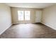 Bright, airy living room with wood-look floors and large windows, ample sunlight at 2350 E Legrande Ave, Indianapolis, IN 46203