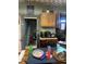 View of the kitchen with a table and chairs, plus an entrance to a stairwell at 2519 N A St, Elwood, IN 46036