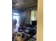 View of the living room with furniture and an open door at 2519 N A St, Elwood, IN 46036