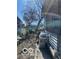 View of the house side yard with patio furniture and grill at 2519 N A St, Elwood, IN 46036