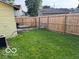 Backyard featuring chainlink and wood fence and green lawn area at 2830 Guilford Ave, Indianapolis, IN 46205