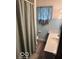 Bathroom with a tiled shower/tub, toilet and single sink vanity at 2830 Guilford Ave, Indianapolis, IN 46205