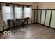 Dining room features wood floors and natural light from the windows at 2830 Guilford Ave, Indianapolis, IN 46205