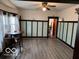 Bright dining room features wood floors and a ceiling fan at 2830 Guilford Ave, Indianapolis, IN 46205